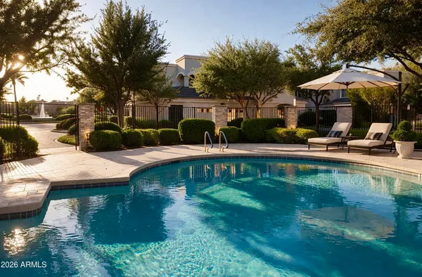 a front view of a house with swimming pool having outdoor seating