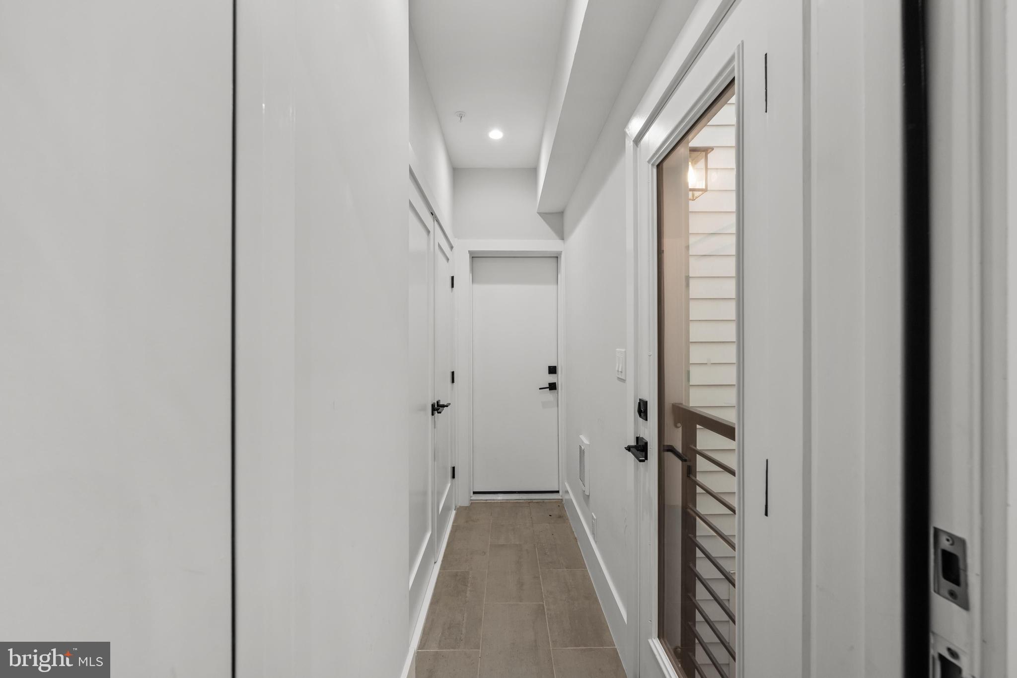 1216 I Street Northeast, Unit A Washington, DC 20002 - Photo 11 of 34 a view of a hallway with wooden floor and staircase