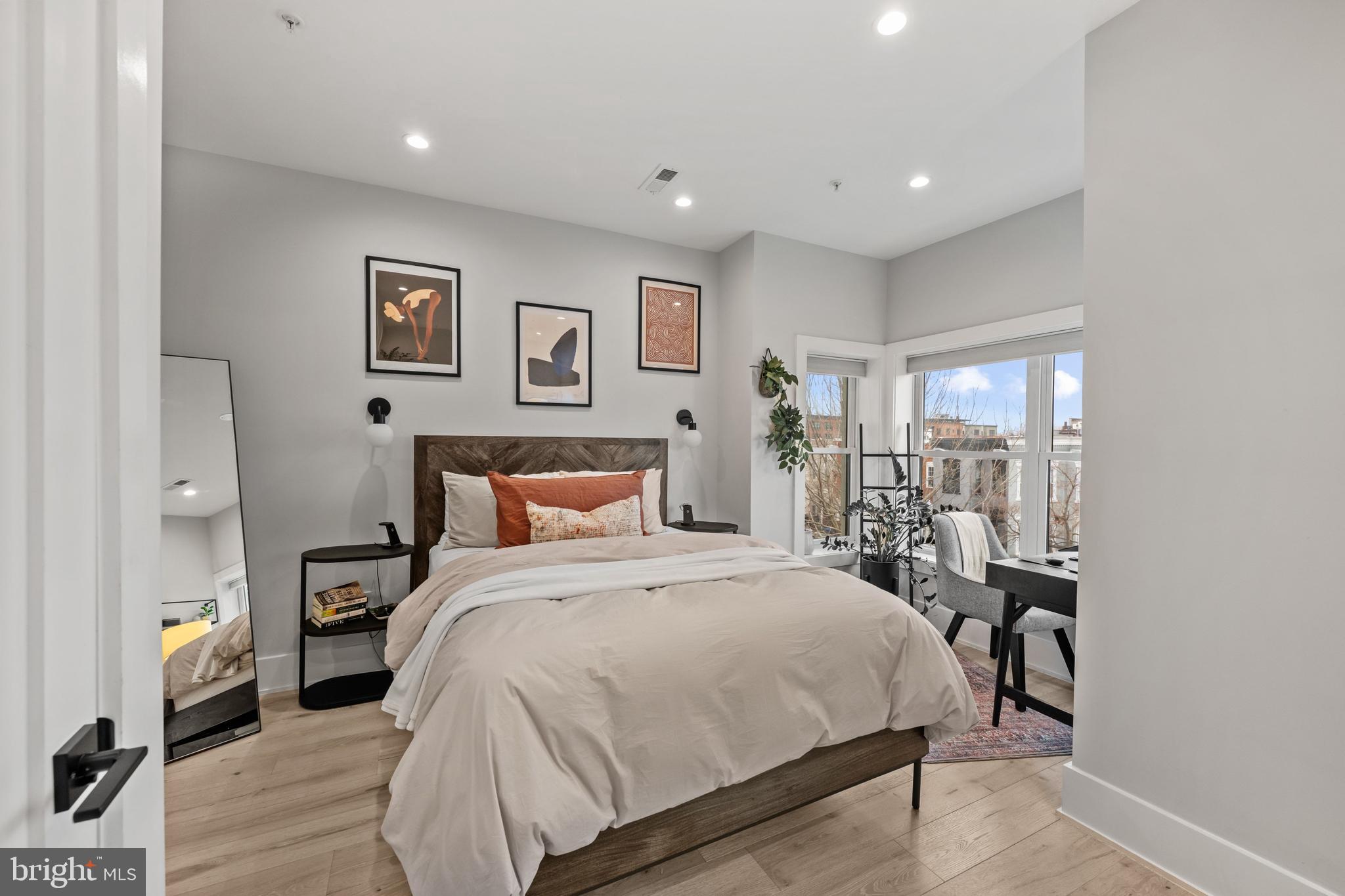 1216 I Street Northeast, Unit A Washington, DC 20002 - Photo 12 of 34 a bedroom with a bed and wooden floor