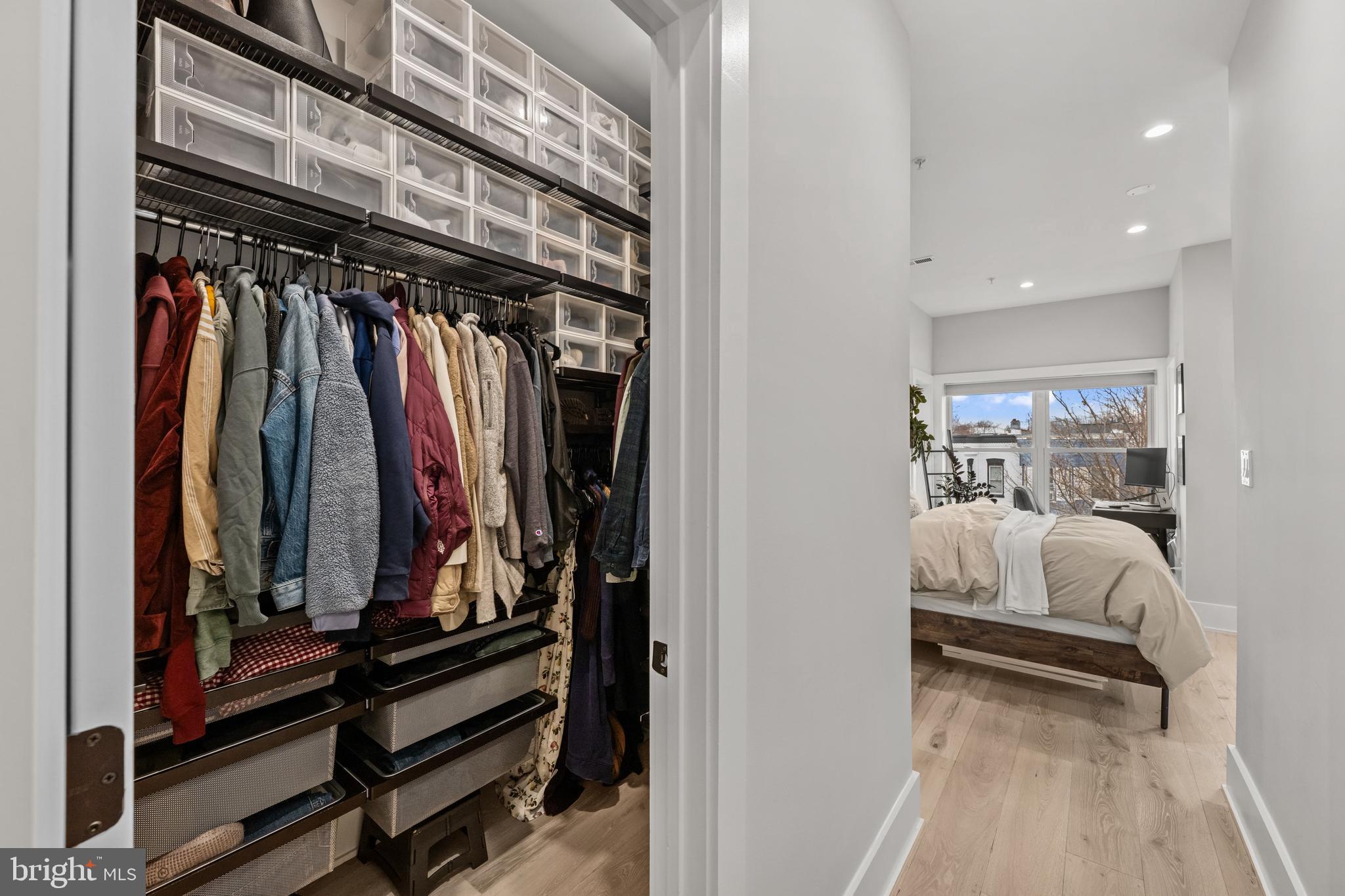1216 I Street Northeast, Unit A Washington, DC 20002 - Photo 15 of 34 a view of walk in closet with clothes and shoes