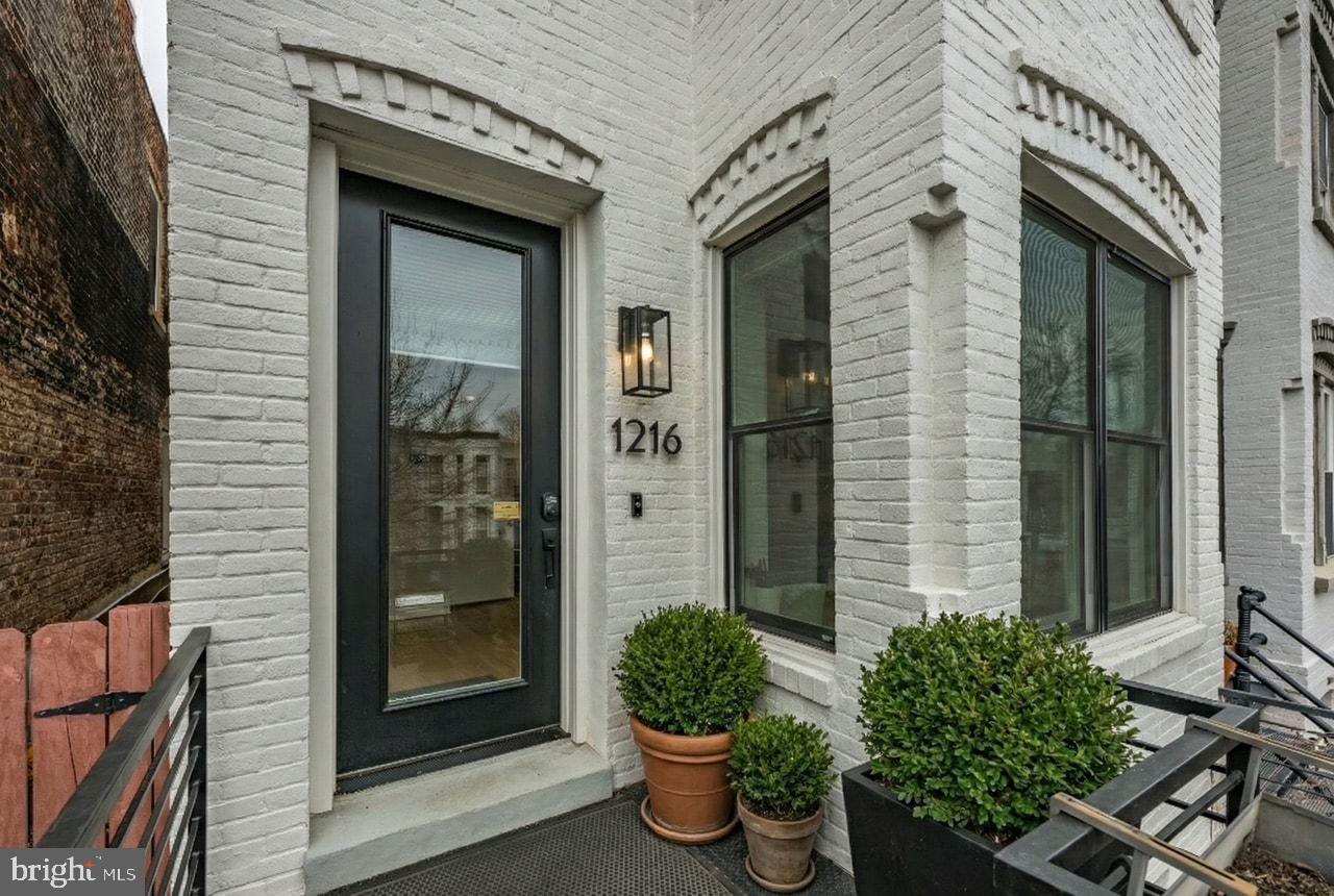1216 I Street Northeast, Unit A Washington, DC 20002 - Photo 2 of 34 a front view of a house with a yard