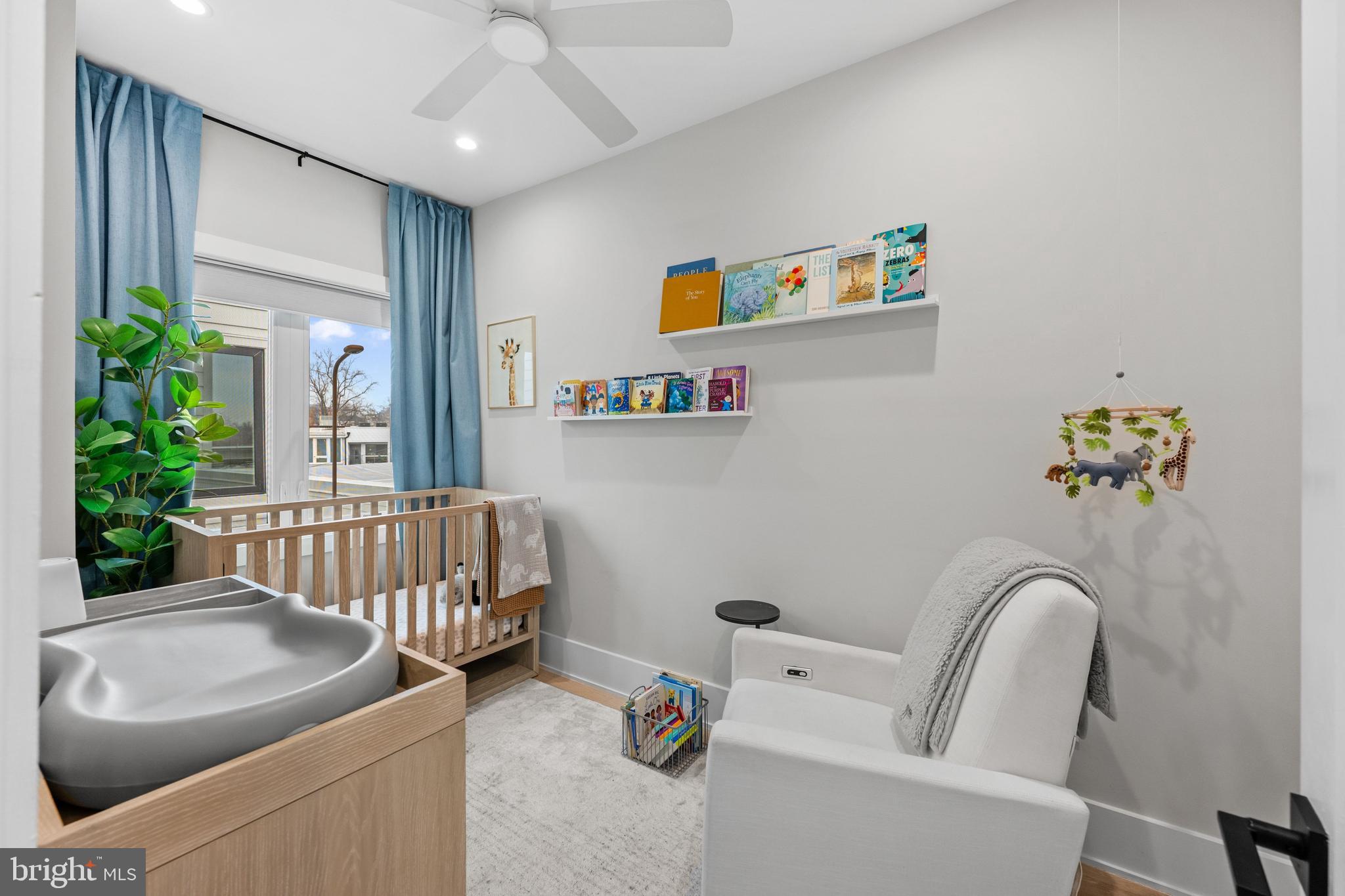 1216 I Street Northeast, Unit A Washington, DC 20002 - Photo 22 of 34 a bedroom with furniture and a couch