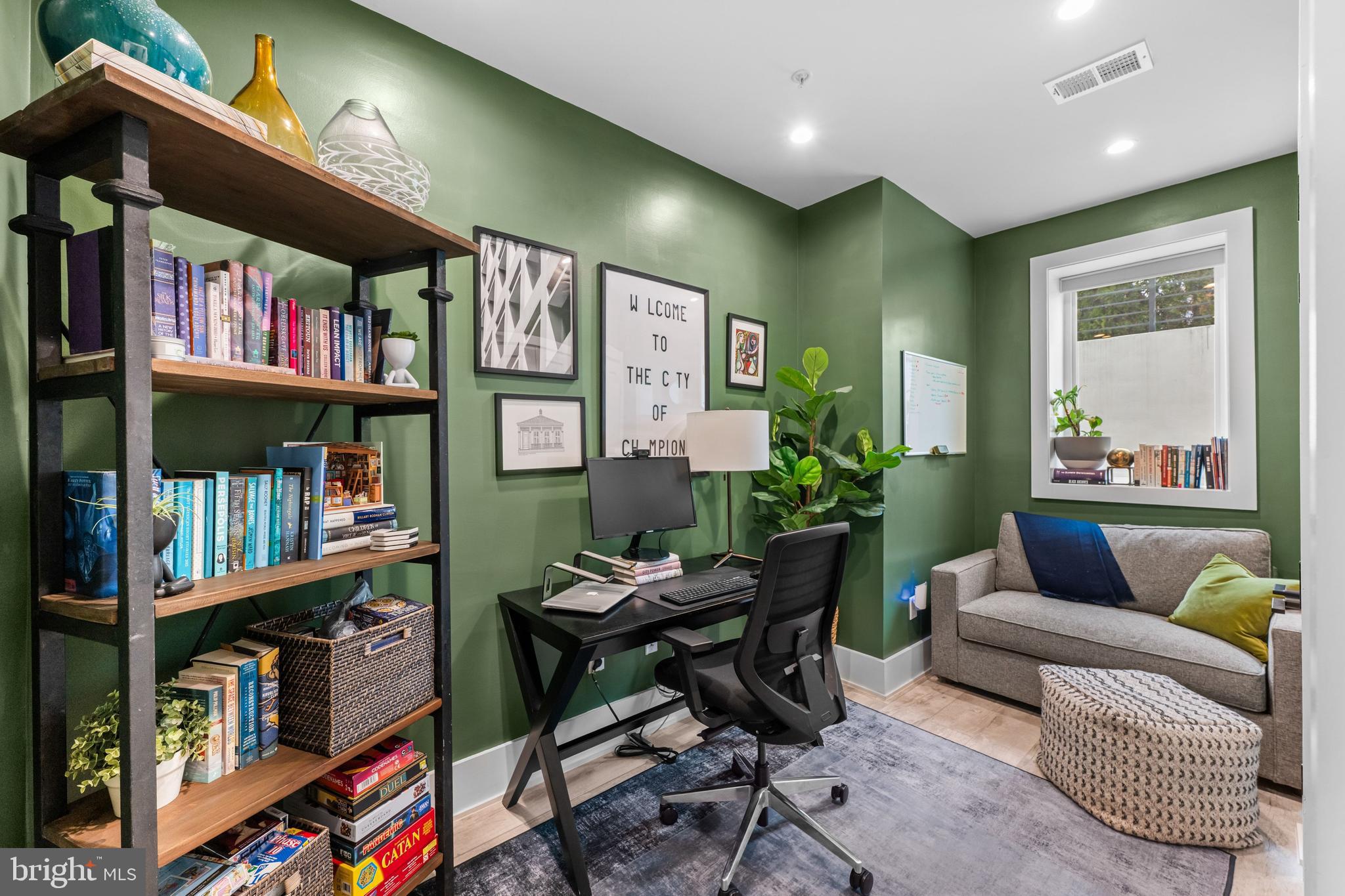 1216 I Street Northeast, Unit A Washington, DC 20002 - Photo 27 of 34 a living room with lots of furniture and a book shelf