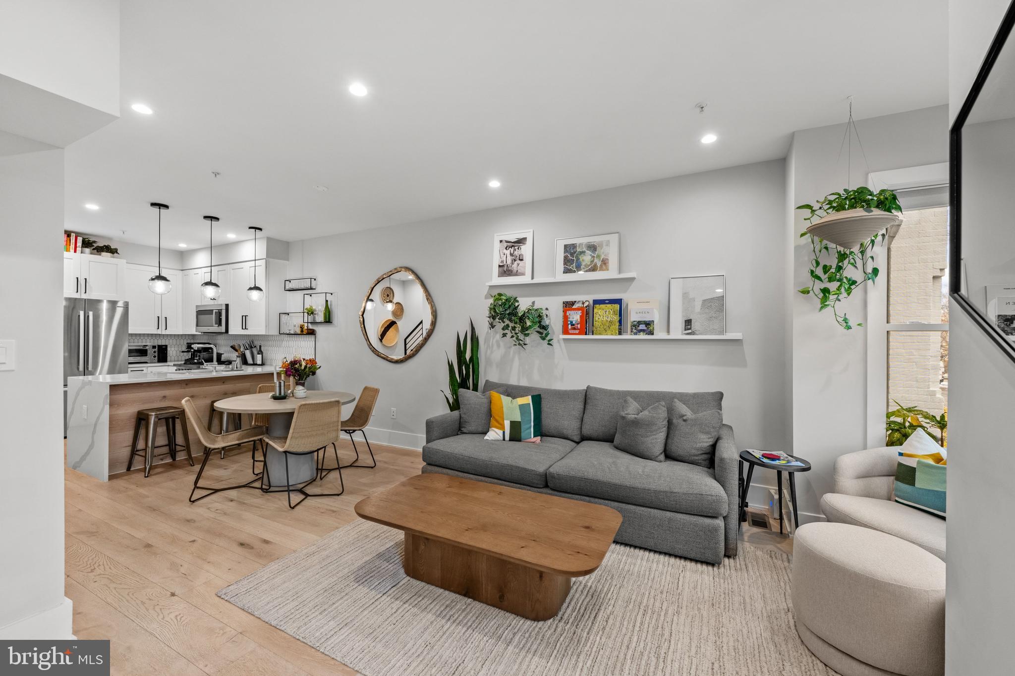 1216 I Street Northeast, Unit A Washington, DC 20002 - Photo 3 of 34 a living room with furniture and a clock