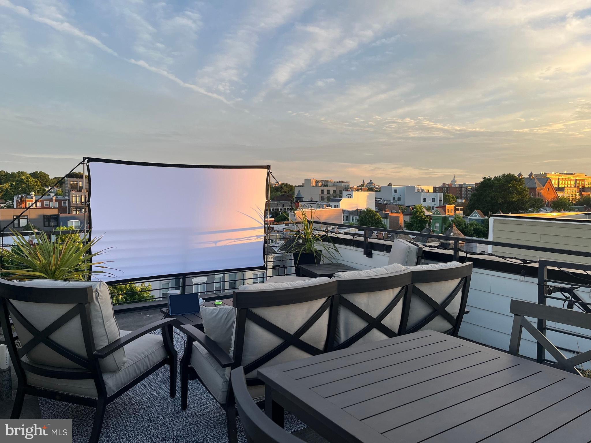 1216 I Street Northeast, Unit A Washington, DC 20002 - Photo 32 of 34 a view of a chairs and table on the deck