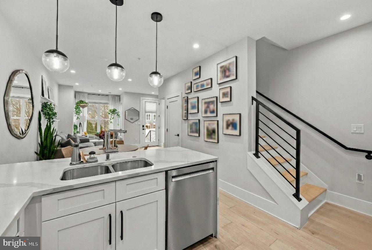 1216 I Street Northeast, Unit A Washington, DC 20002 - Photo 9 of 34 a very nice looking room with a large window and chandelier