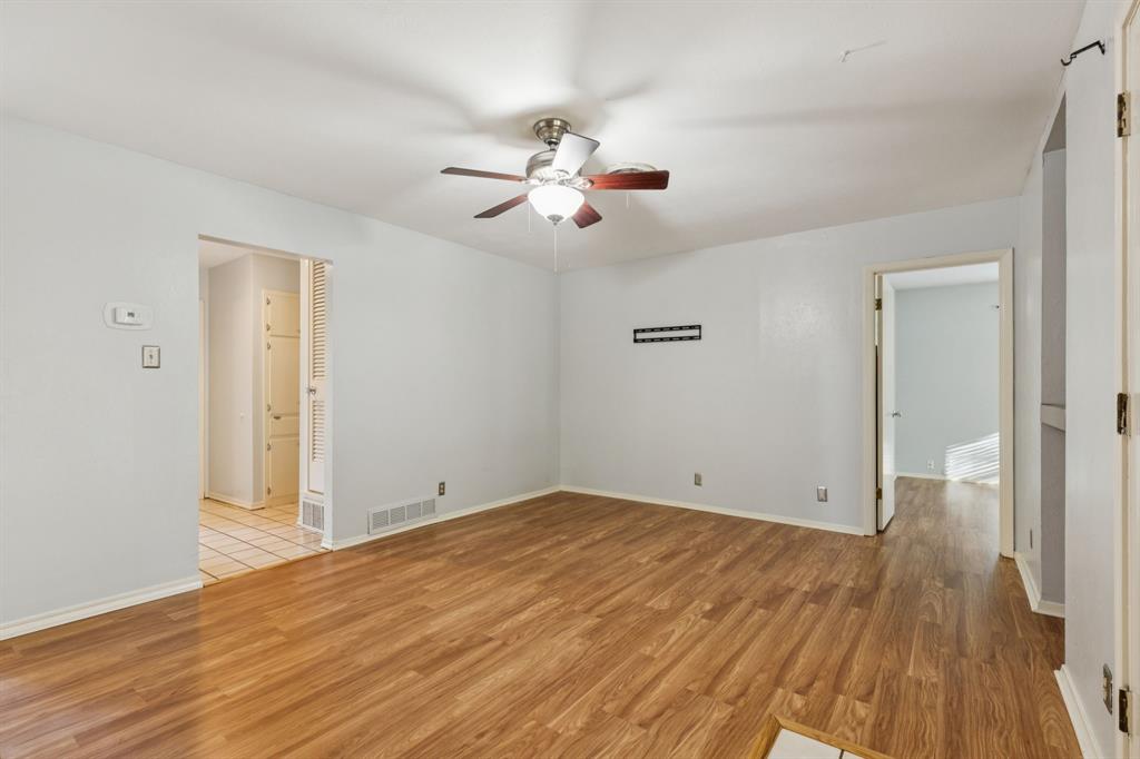 1602 England Road Arlington, TX 76013 - Photo 14 of 27 wooden floor in an empty room with a window