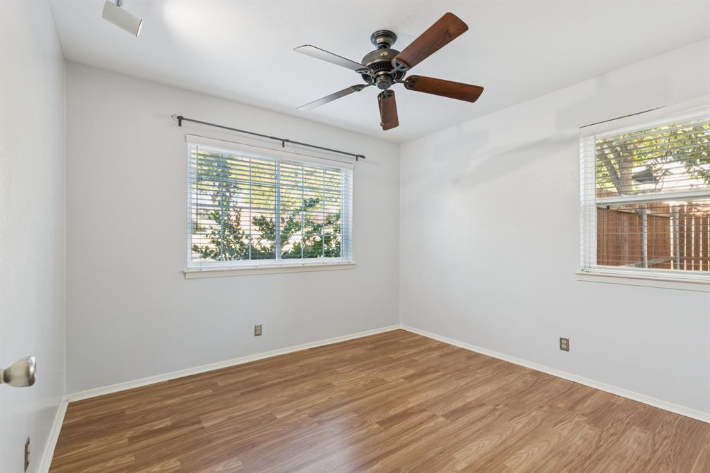 1602 England Road Arlington, TX 76013 - Photo 20 of 27 a view of empty room with wooden floor and fan