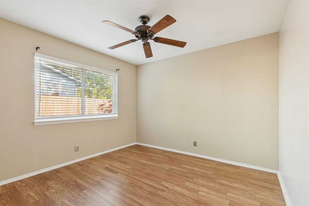 1602 England Road Arlington, TX 76013 - Photo 21 of 27 a view of a big room with wooden floor and windows in a room
