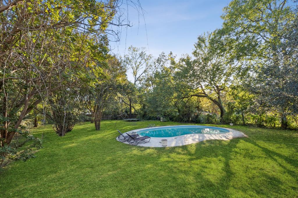 1602 England Road Arlington, TX 76013 - Photo 27 of 27 a big yard with lots of green space and trees in the back