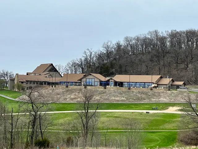 a small pool is sitting in the middle of a lake