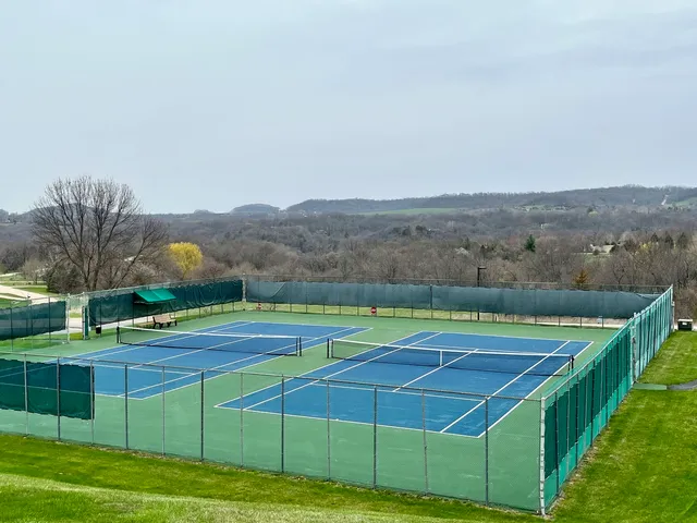 a view of an outdoor space and tennis court