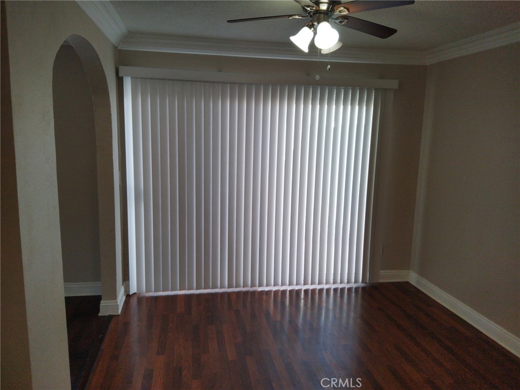 44535 La Paz Road, Unit D Temecula, CA 92592 - Photo 9 of 10 a view of wooden floor and a chandelier in a room