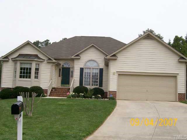 5200 Thorpe Drive Raleigh, NC 27613 - Photo 2 of 10 a front view of a house with a garden