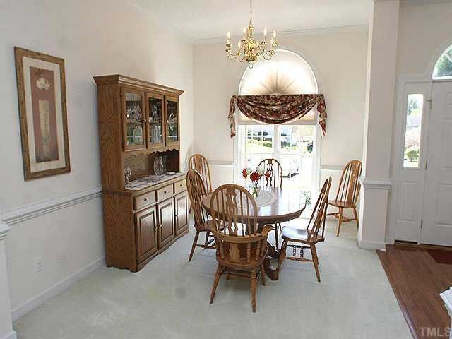 5200 Thorpe Drive Raleigh, NC 27613 - Photo 4 of 10 a view of a dining room with furniture and chandelier
