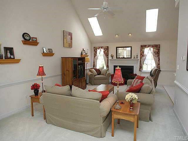 5200 Thorpe Drive Raleigh, NC 27613 - Photo 5 of 10 a living room with furniture a flat screen tv and a couch