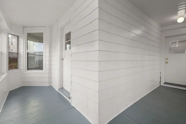 a view of an empty room and a window