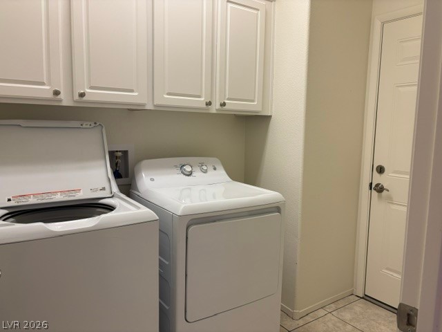 2866 Shimmering Bay Street Laughlin, NV 89029 - Photo 12 of 32 Functional laundry space featuring convenient washer and dryer units beneath storage cabinetry.