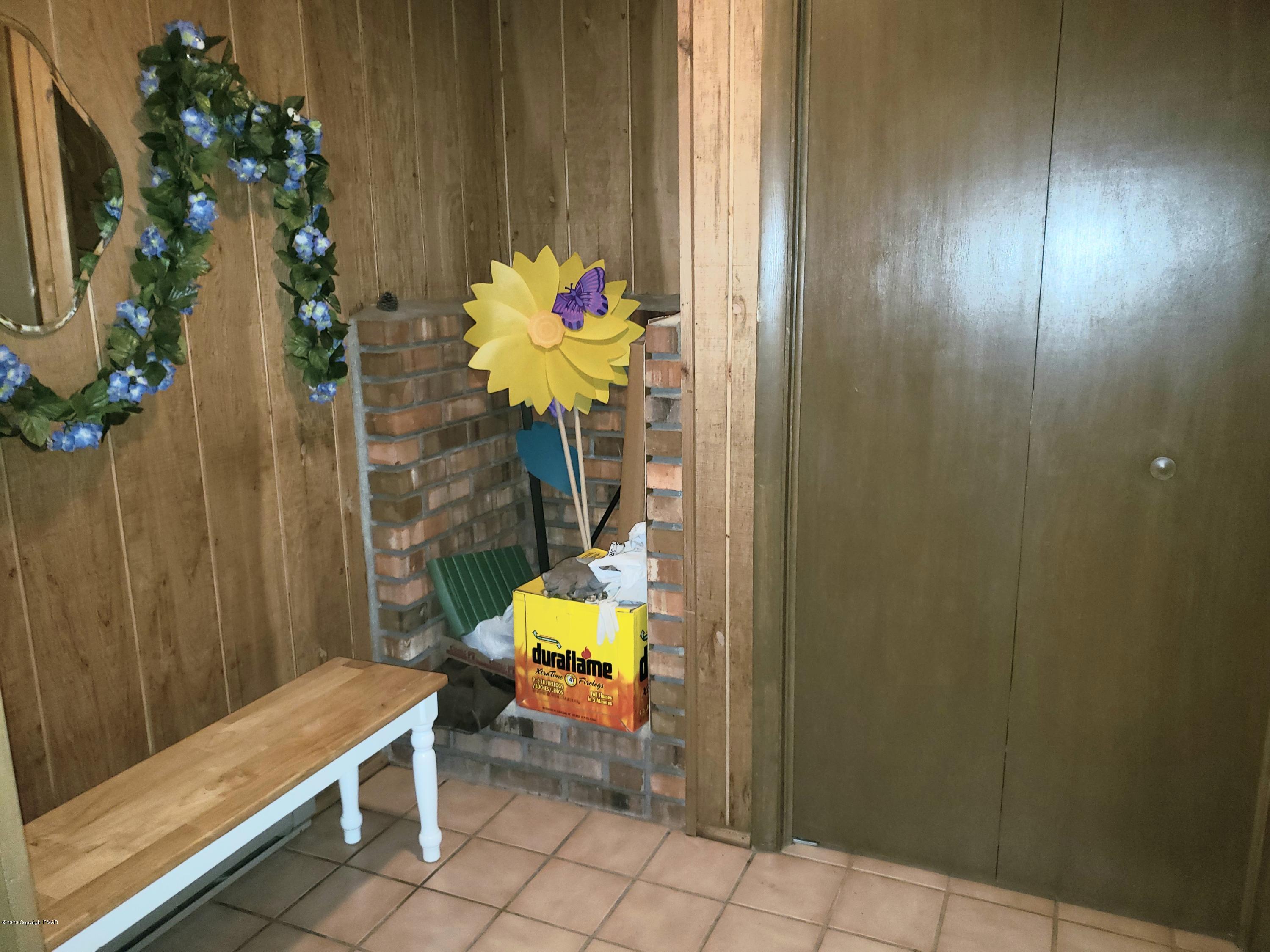 1437 Clover Road Long Pond, PA 18334 - Photo 23 of 38 a view of a entryway with flower pots
