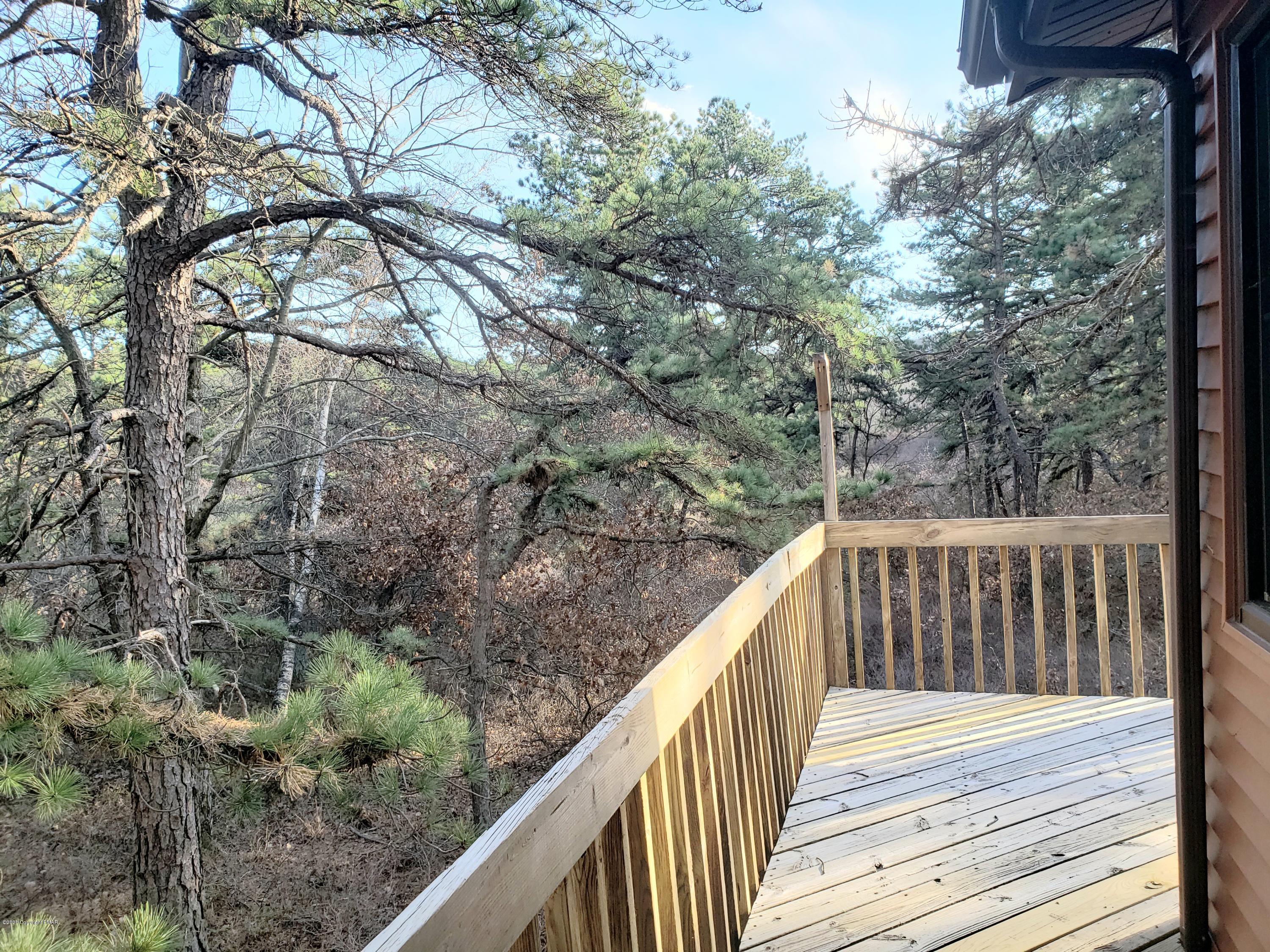 1437 Clover Road Long Pond, PA 18334 - Photo 28 of 38 a view of balcony with wooden floor and fence