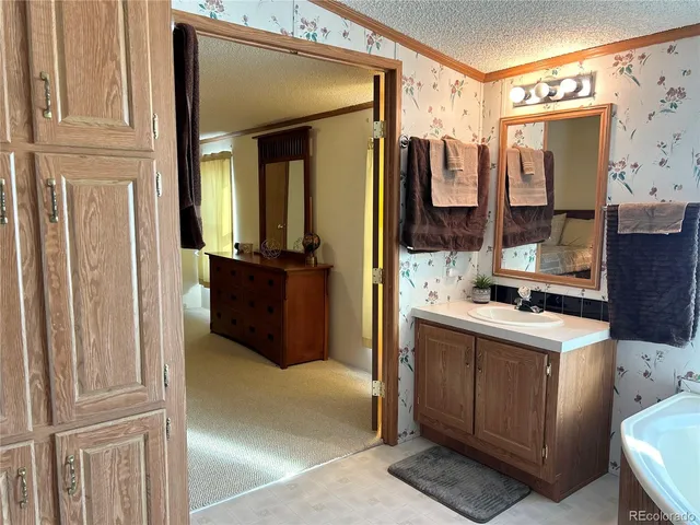 a view of a bathroom with a sink and mirror