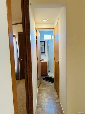 a view of a bathroom from a hallway