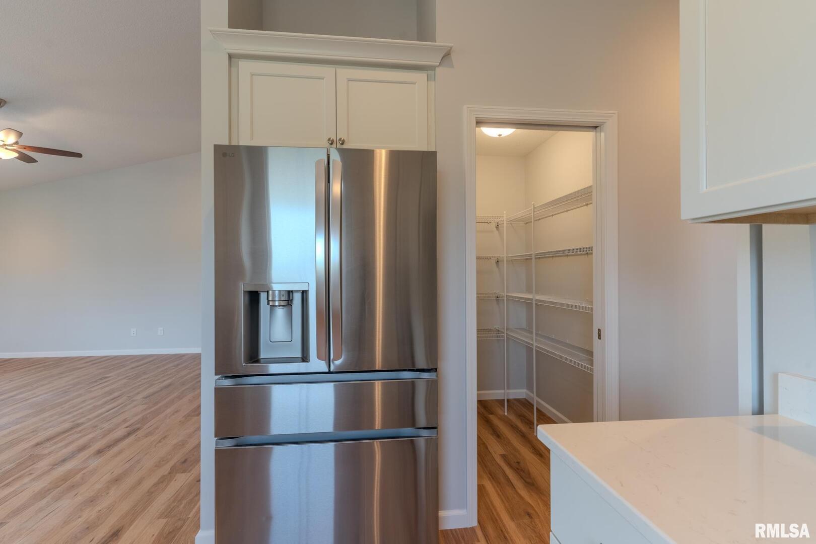 941 9th Avenue North Clinton, IA 52732 - Photo 5 of 24 a kitchen with kitchen island a counter top space and refrigerator