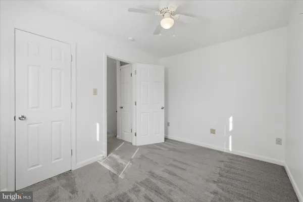 a picture of a bench in a white building