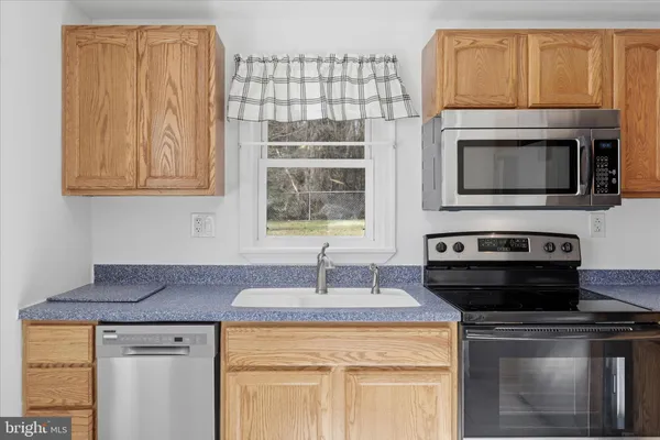 a kitchen with a stove and a microwave