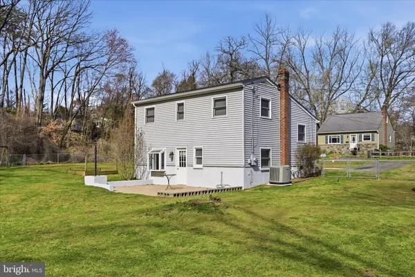 a view of a park with large trees