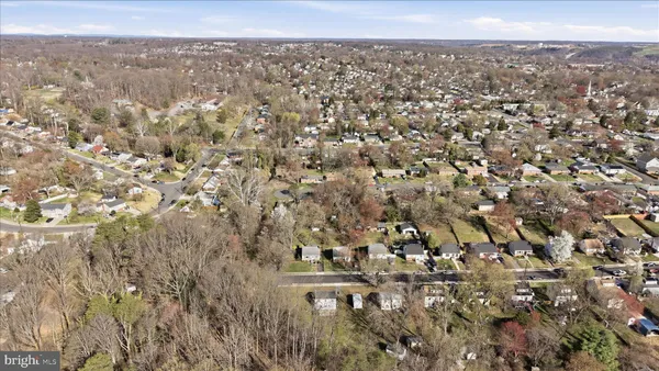 an aerial view of residential building with green space
