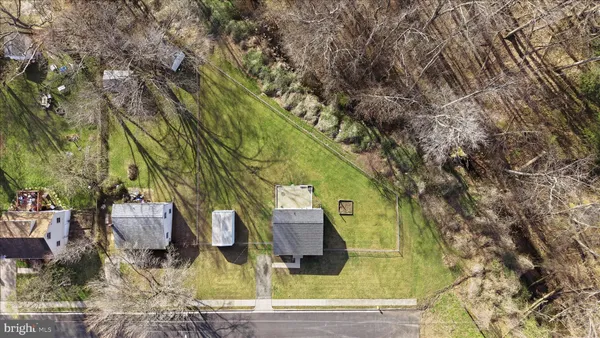 an aerial view of residential building with green space