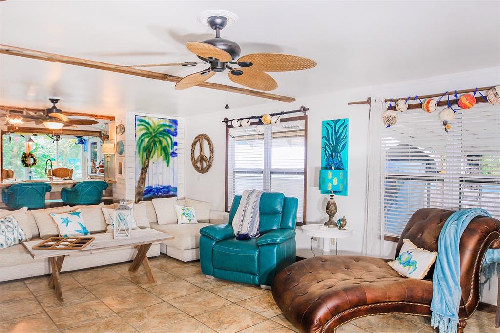 4380 Benview Avenue Weeki Wachee, FL 34607 - Photo 14 of 56 a living room with furniture and a window