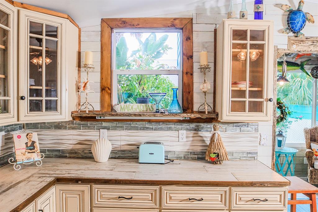 4380 Benview Avenue Weeki Wachee, FL 34607 - Photo 21 of 56 a kitchen with granite countertop a sink and a window