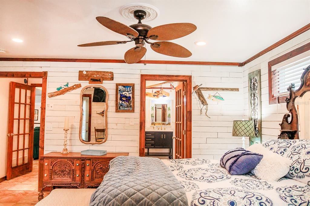 4380 Benview Avenue Weeki Wachee, FL 34607 - Photo 30 of 56 a bedroom with a bed and wooden floor