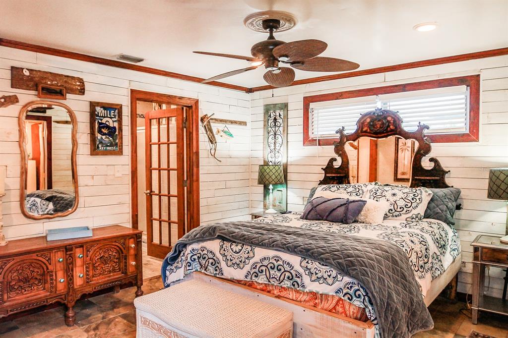 4380 Benview Avenue Weeki Wachee, FL 34607 - Photo 31 of 56 a bedroom with a bed and wooden floor