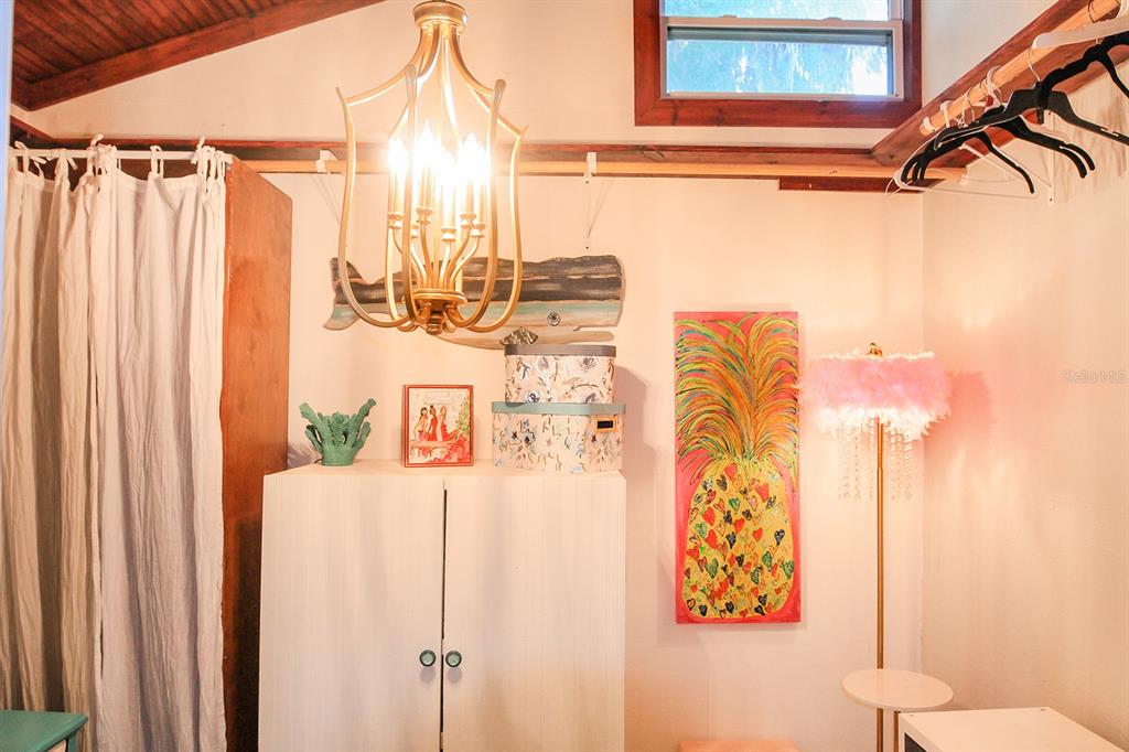4380 Benview Avenue Weeki Wachee, FL 34607 - Photo 32 of 56 a bathroom with a shower curtain and a window