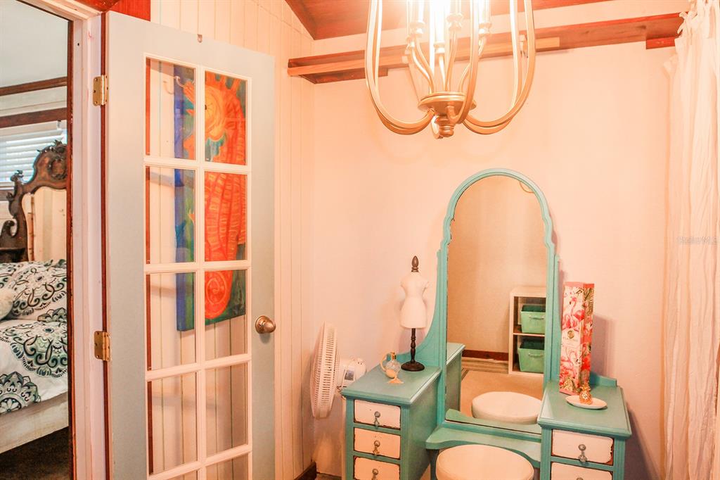 4380 Benview Avenue Weeki Wachee, FL 34607 - Photo 33 of 56 a room that has painting on the wall and a window