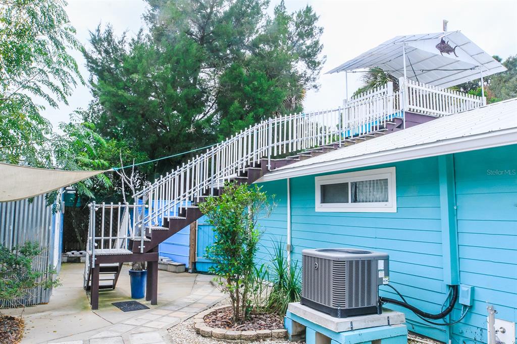 4380 Benview Avenue Weeki Wachee, FL 34607 - Photo 49 of 56 a view of a house with wooden deck and furniture