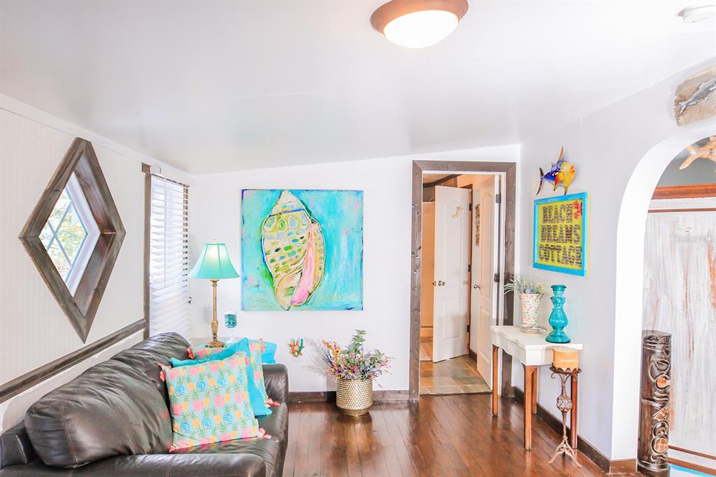 4380 Benview Avenue Weeki Wachee, FL 34607 - Photo 8 of 56 a living room with furniture and a wooden floor