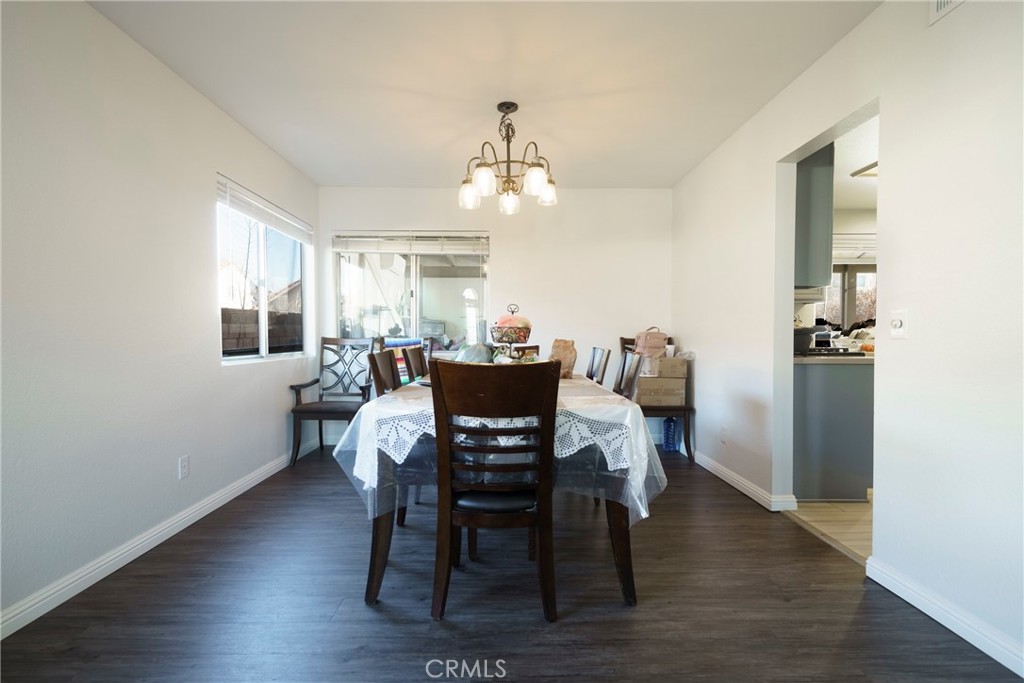 43922 Fallon Drive Lancaster, CA 93535 - Photo 11 of 36 a view of a dining room with furniture window and wooden floor
