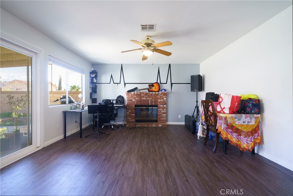 43922 Fallon Drive Lancaster, CA 93535 - Photo 15 of 36 a living room with furniture and a wooden floor