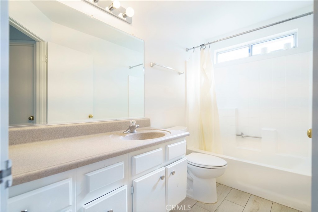 43922 Fallon Drive Lancaster, CA 93535 - Photo 17 of 36 a bathroom with a sink a toilet and shower