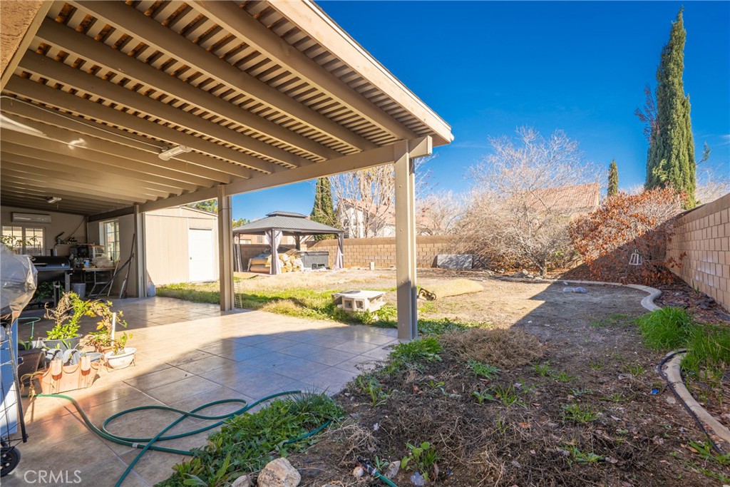 43922 Fallon Drive Lancaster, CA 93535 - Photo 25 of 36 a view of swimming pool with lawn chairs and plants