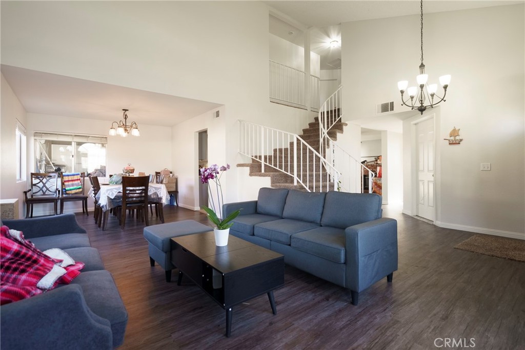 43922 Fallon Drive Lancaster, CA 93535 - Photo 9 of 36 a living room with furniture or kitchen view and a wooden floor