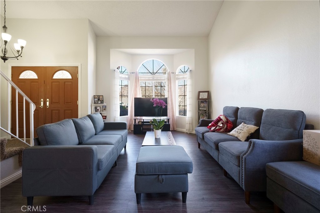 43922 Fallon Drive Lancaster, CA 93535 - Photo 10 of 36 a living room with furniture and a large window