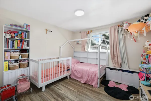 a bedroom with furniture and a window