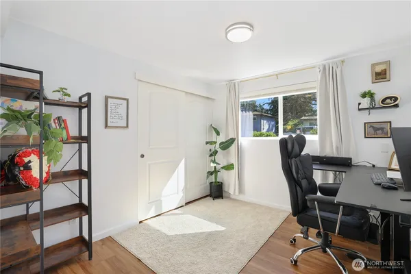 a view of a workspace with furniture and a workspace