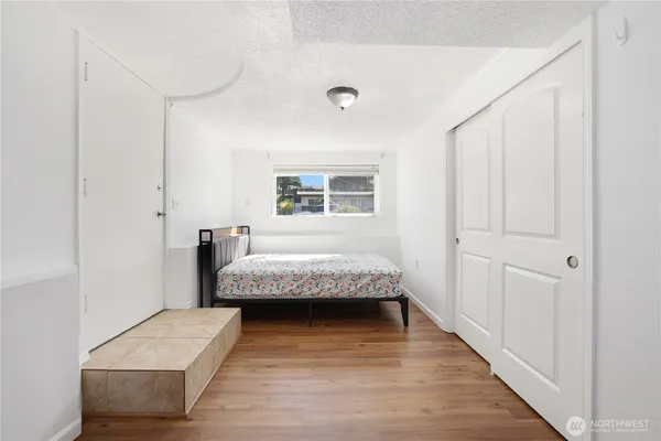 a room with a bed and a window