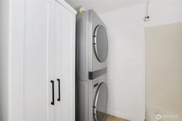 a close view of a utility room with dryer and washer